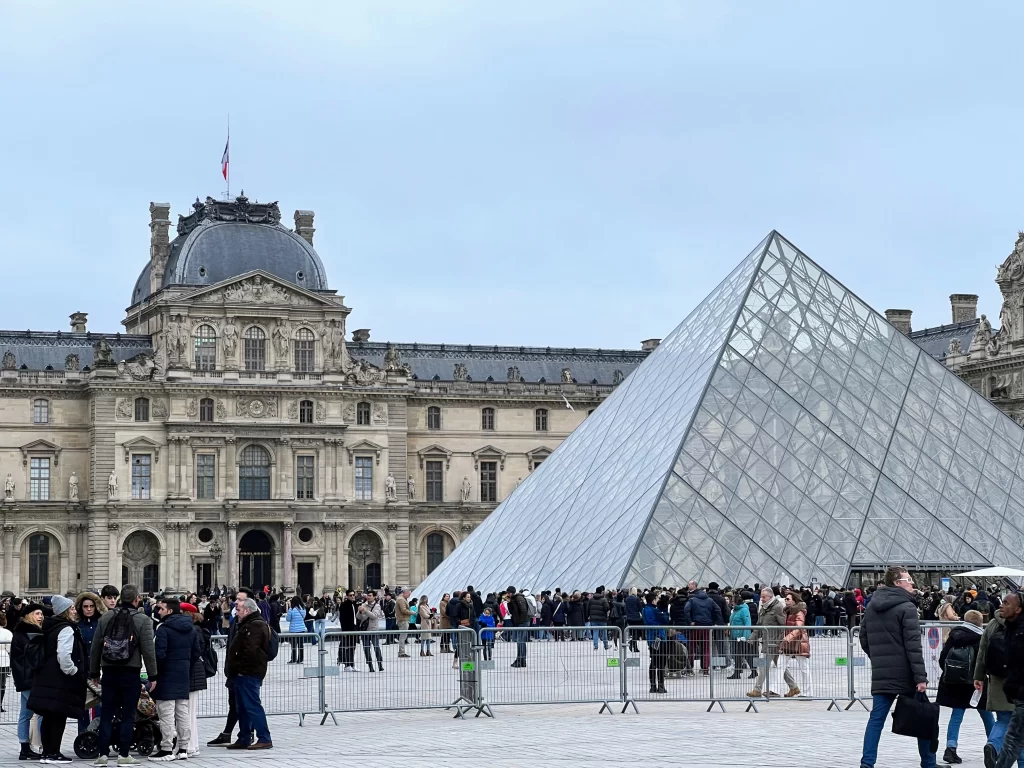 view the square place with the Louvre and its Pyramid
