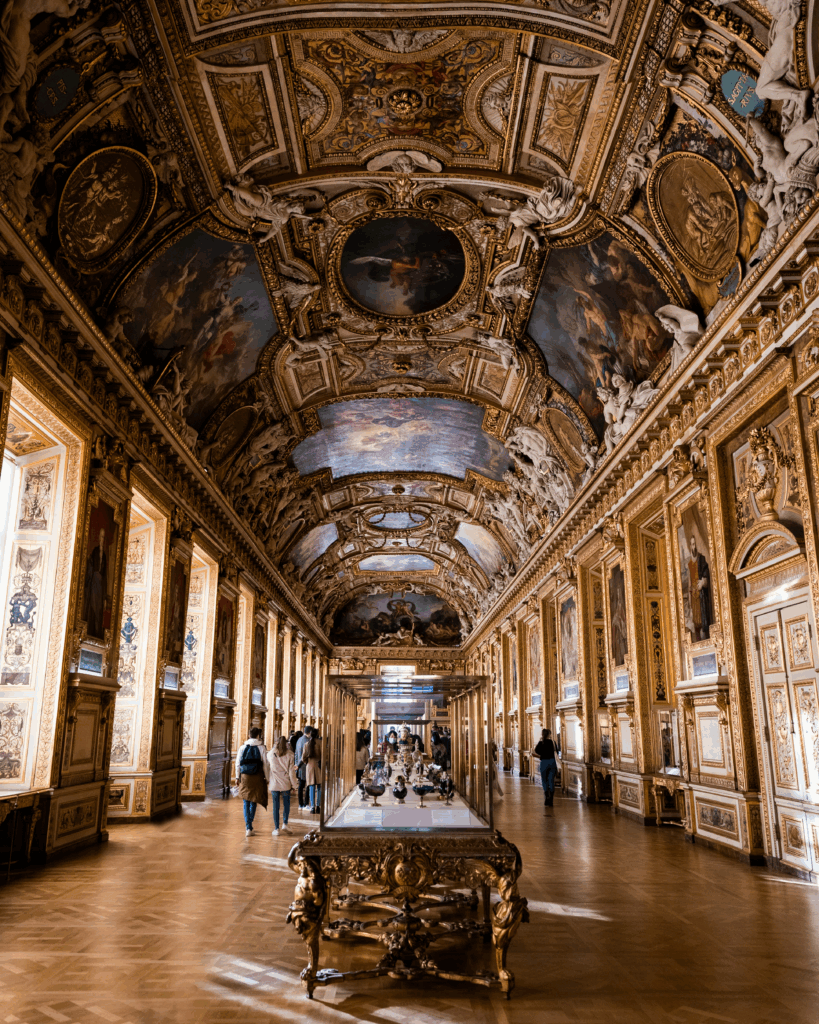 Ornate ceiling and golden decor of the Apollo Gallery in the Louvre Museum, Paris