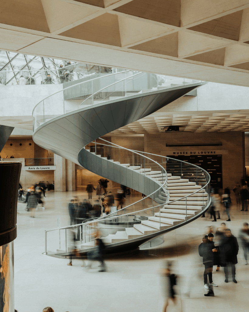Spiral stairs under the Louvre Pyramid